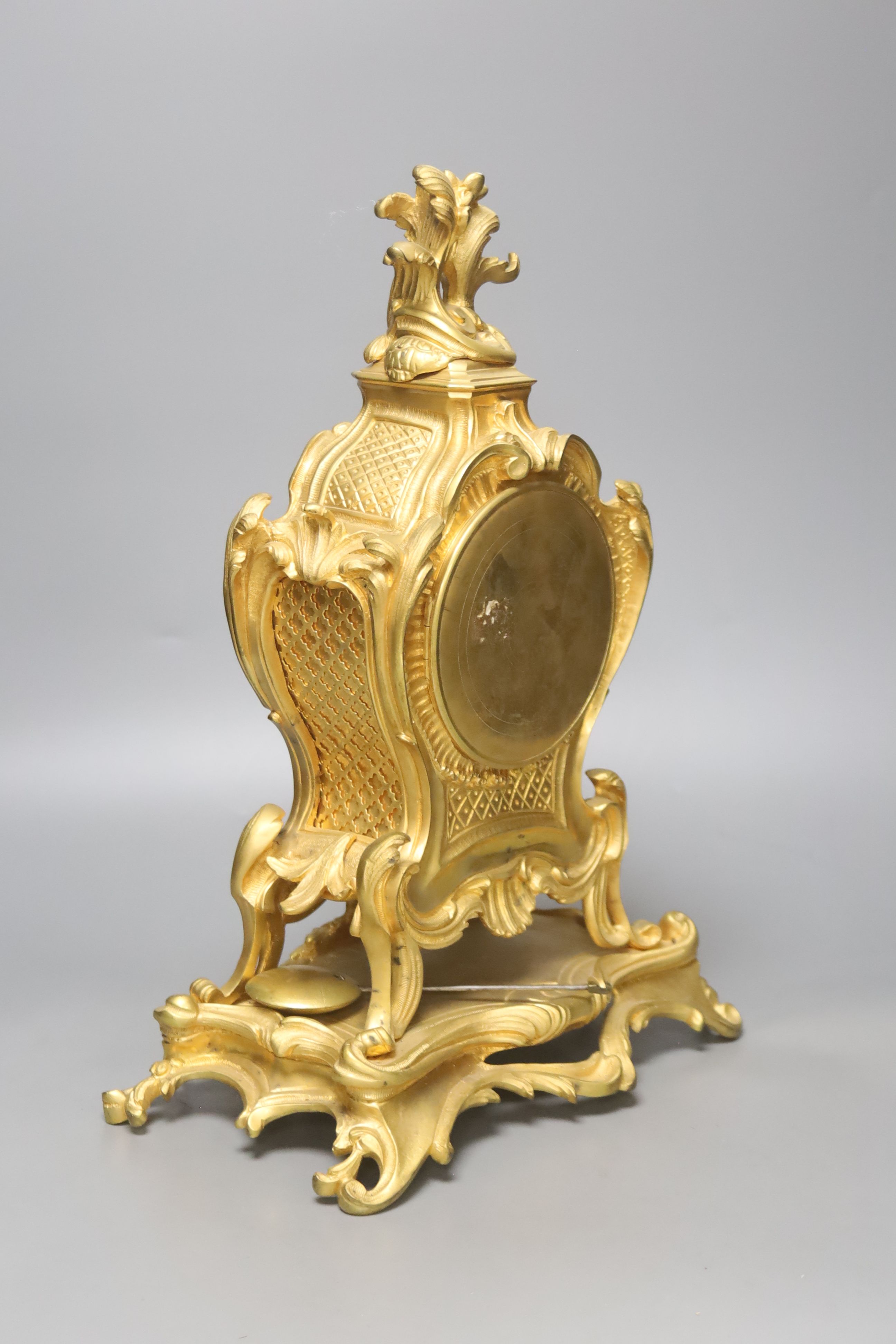 A late 19th-century French rococo revival gilt mantel clock, 40cm high